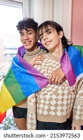 Beautiful Gay Couple Having Fun At Home With A Lgbt Flag