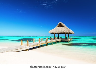 Beautiful gazebo on the tropical white sandy beach in Punta Cana, Dominican Republic - Powered by Shutterstock