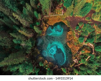 Beautiful Geyser (blue, Silver) Lake With Thermal Springs That Periodically Throw Blue Clay And Silt From The Ground. Aerial Drone View. Aktash, Altai Mountains, Russia