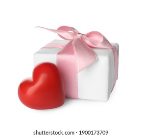 Beautiful gift box and red heart on white background. Valentine's day celebration