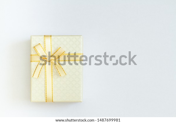 Download Beautiful Gift Box Yellow Bow On Stock Photo Edit Now 1487699981 PSD Mockup Templates