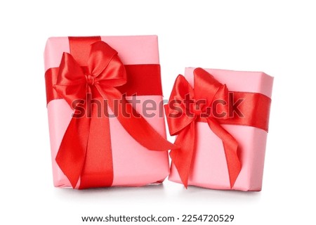 Beautiful gifts with red ribbon on white background. Valentine's Day celebration