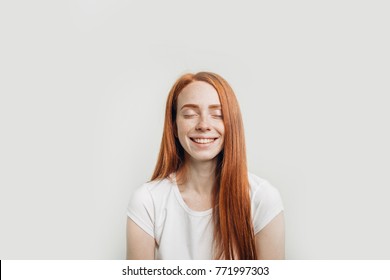 Beautiful Ginger Girl Smiling Posing With Closed Eyes.