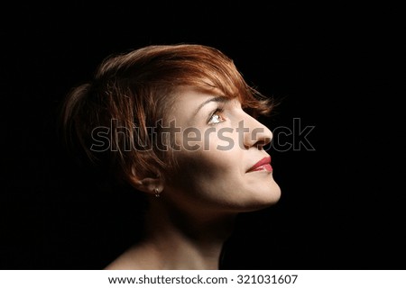 Similar – Hopeful Portrait of a Young Woman at the Window