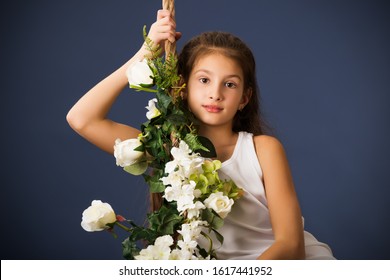 Beautiful Girl Alone Swinging On Flower Swing.