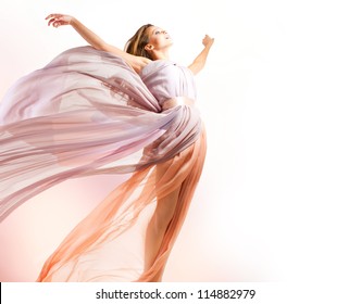 Beautiful Girl in blowing Dress Flying. Free. Freedom concept