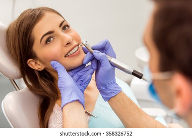 Beautiful Girl With Braces On The Teeth, At A Reception At The Dentist