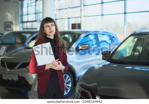 Beautiful girl with car\
cardboard to sign