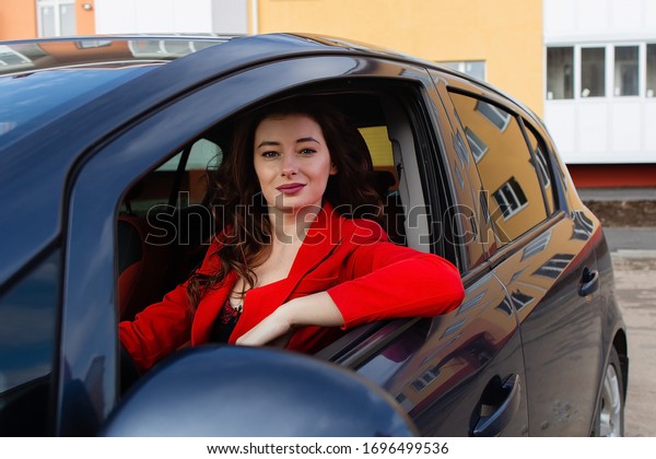 A Beautiful girl in\
the car with phone
