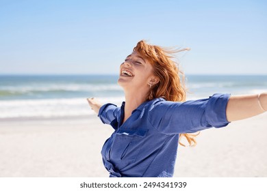 Beautiful girl in casual outfit enjoying sunbath at beach with arms outstretched. Close up face of young curvy woman with closed eyes enjoying breeze at seaside. Carefree woman with freckles. - Powered by Shutterstock