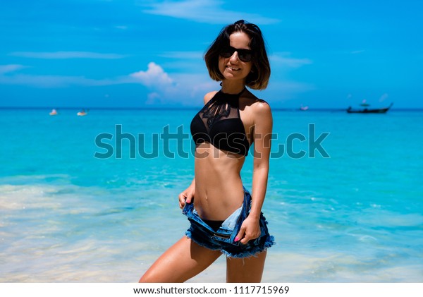 Beautifull girl changing on beach