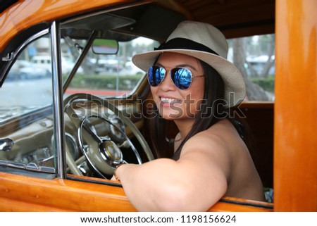 Beautiful Girl in a Classic Car.