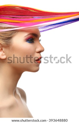 Beautiful girl with colorful makeup and hairstyle on white background