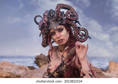 Beautiful Girl In The Costume Of The Sea Witch , Against The Background Of The Sea, Close-up, Portrait