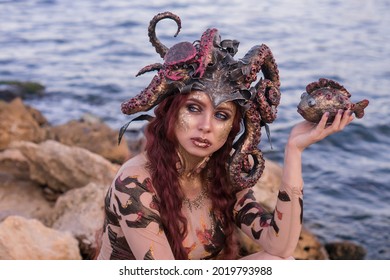 Beautiful Girl In The Costume Of The Sea Witch Ursula, Against The Background Of The Sea, Close-up, Portrait
