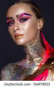 Beautiful girl with creative glitter makeup with sparkles, unusual eyebrows. Beauty is an art face. Photo taken in the studio.