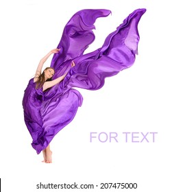 Beautiful girl dancer in violet flying dress on white background