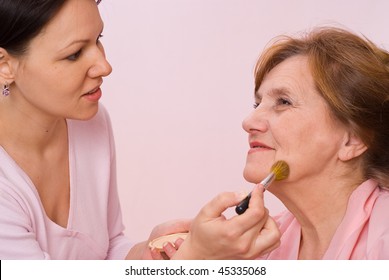 Beautiful Girl Doing An Older Woman Makeup