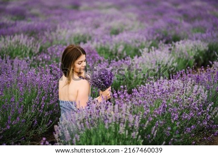 Similar – Woman posing in field of white flowers