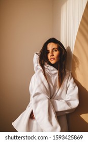 Beautiful Girl Dressed In Sports Clothes. Brunette With Long Hair Posing. She Is Dressed In White Hoodie. Winter, Fall Or Spring Outfit. Sun Light On Face. Basic Long Sleeve Hooded Sweatshirt.