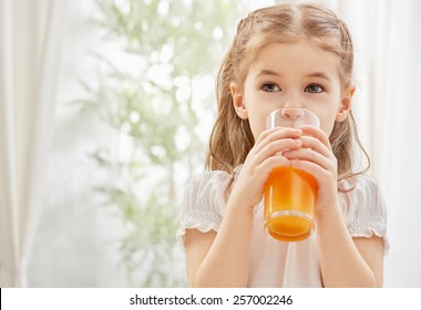 A Beautiful Girl Drinking Fresh Juice