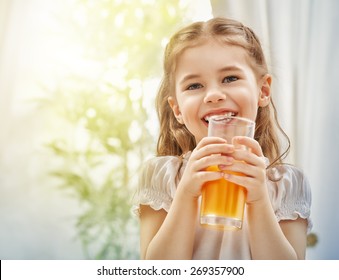 A Beautiful Girl Drinking Fresh Juice