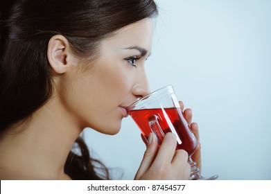 Beautiful Girl Drinking Healthy Hot Red Tea