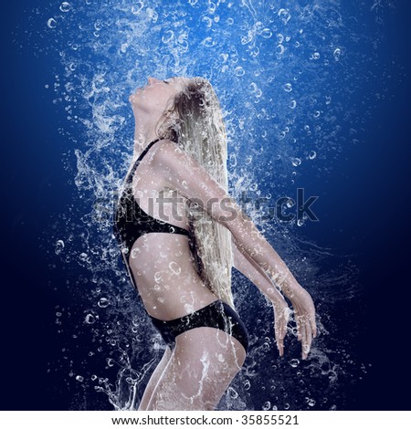 Beautiful girl in drops under water