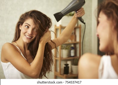 Beautiful Girl Drying Her Hair