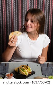 Beautiful Girl Eating Mexican Food With Her Hands