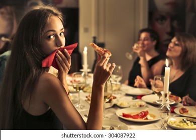 Beautiful girl eating pizza