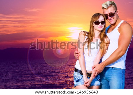 beautiful girl embraces the guy