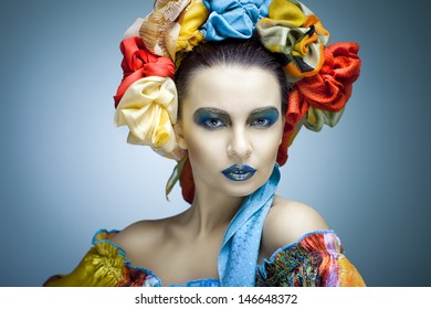 beautiful girl in ethnic dress with an ornament on her head and with perfect makeup - Powered by Shutterstock