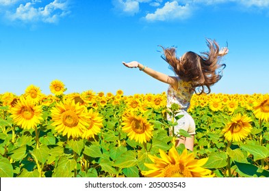 Beautiful Girl In A Field Of Sunflowers