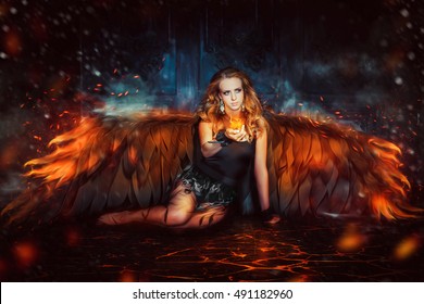 
Beautiful girl with fiery black wings, sitting on the floor. Dark Angel