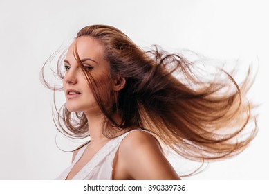 beautiful girl with flowing hair on a white background
