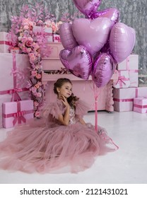 a beautiful girl in a fluffy airy pink dress, near a pink piano, a piano with a huge number of flowers, a lot of flowers, in a festive mood, congratulates everyone on Valentine's Day, Valentine's Day 