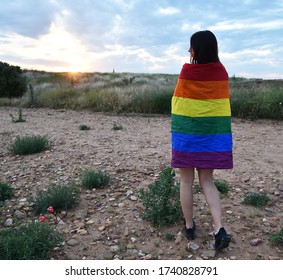 A Beautiful Girl With The Gay Pride Flag Exercising In The Field In 2020