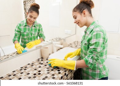 Beautiful Girl In Gloves Cleaning Bathroom Sink