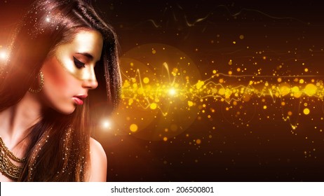 beautiful girl with a golden mask make up
