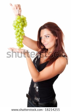 beautiful girl with green grapes on a white background