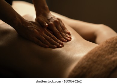 The Beautiful Girl Has Massage. Authentic Image Of Luxury Spa Treatment. Warm Colors, Charming Light.