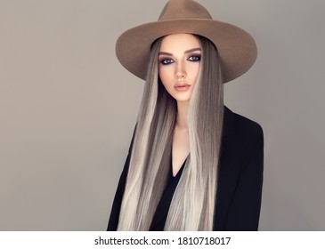Beautiful girl in a hat with long blonde straight hair . Fashionable coloring of shatush. Beauty, cosmetics and fashion
