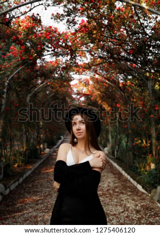 Similar – Image, Stock Photo Blonde woman with hat taking a walk in the forest at sunset with the sun in the background.