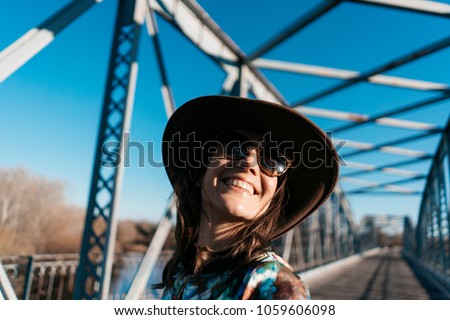 Similar – Happy young woman looking back through the window car