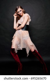 Beautiful Girl In High Boots. Fashion Photography