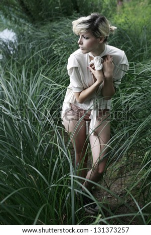 Similar – beautiful young woman siiting outdoors in forest, dreaming with closed eyes in serene pose