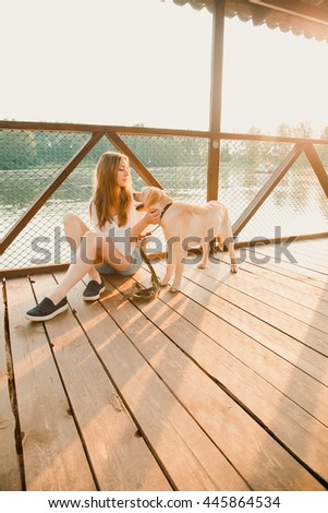 A beautiful girl and his dog