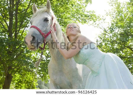A beautiful girl with a horse