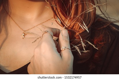 Beautiful girl with jewelry in the nature. A set of jewelry for women, necklace and ring. Beauty and accessories bijouterie. - Powered by Shutterstock